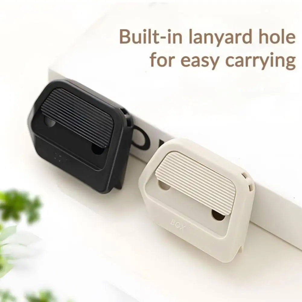 A black and white box cutter with a built-in lanyard hole for easy carrying.