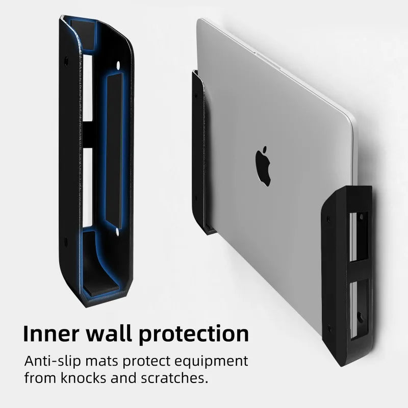 An under-desk laptop mount with inner wall protection and anti-slip mats shown next to a silver laptop.