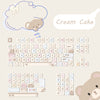 A collection of light pink and beige PBT keycaps for a mechanical keyboard, featuring cute animal and food themes.