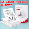 A stack of 200 sheets of A4 folded thermal paper in a red box and loose sheets.