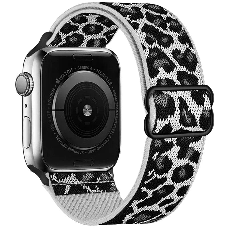 Apple Watch with a leopard print nylon band and a black silicone case.