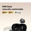 A pair of beige and black Mini Style Bluetooth earbuds shown next to their charging case.