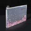 A transparent zipper file bag for an A4 notebook featuring a delicate pink cherry blossom floral design.