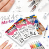A collection of nail art marker pens and tools including various colors and tips shown on fingers.