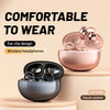 A pink wireless headphone charging case and a dark gray open ear clip design are shown on a light surface.