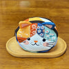 A colorful patchwork cat face coin purse with a zipper, featuring orange, blue, and white floral patterns.
