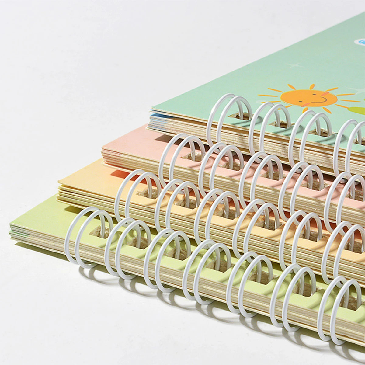 A stack of four colored magic exercise transcribing pens for kids, showing various pastel shades.