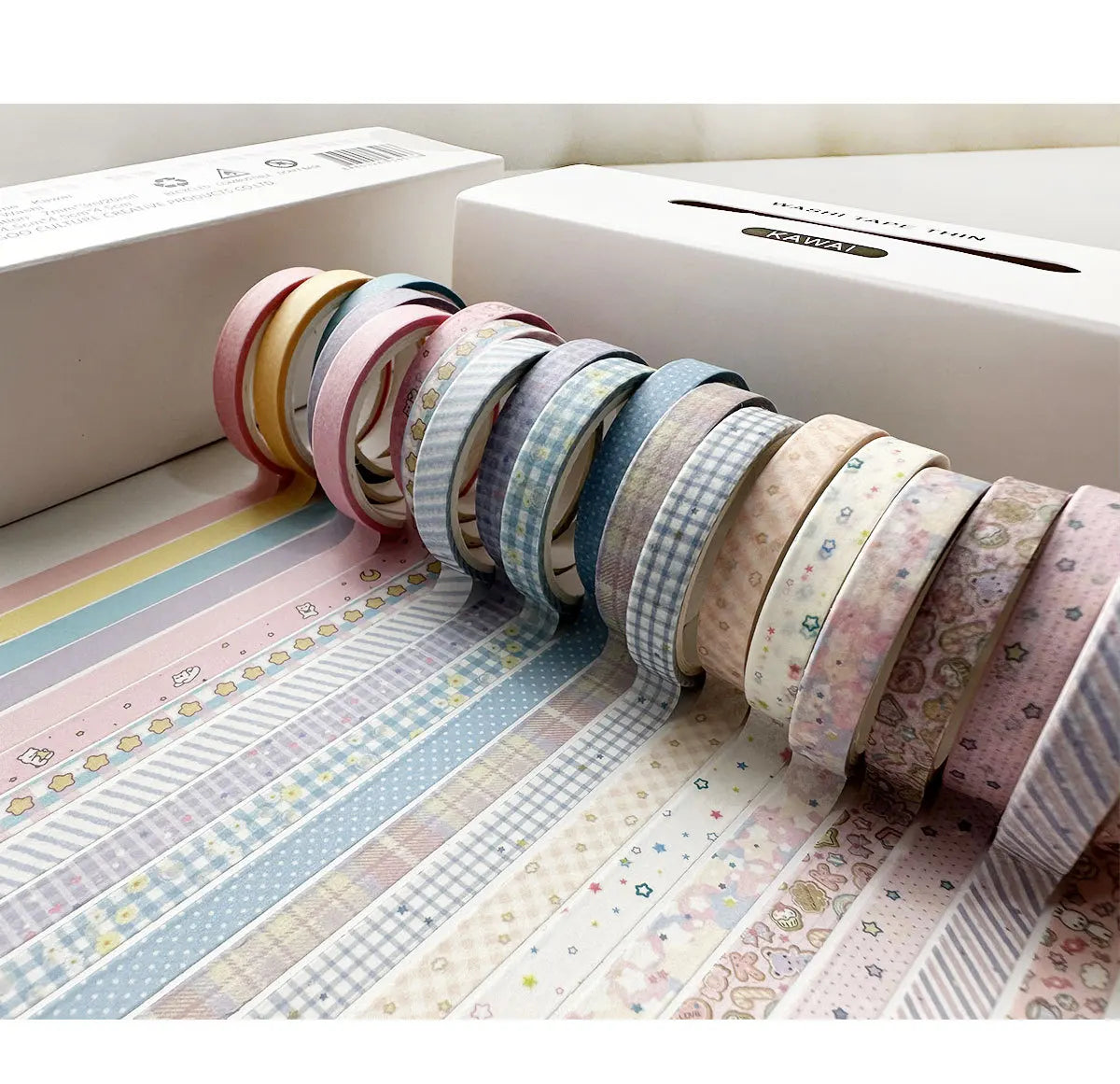 A collection of colorful retro washi tape rolls displayed on a white box.