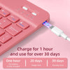 A pink universal slim protective case with an integrated keyboard is shown charging via a connector.