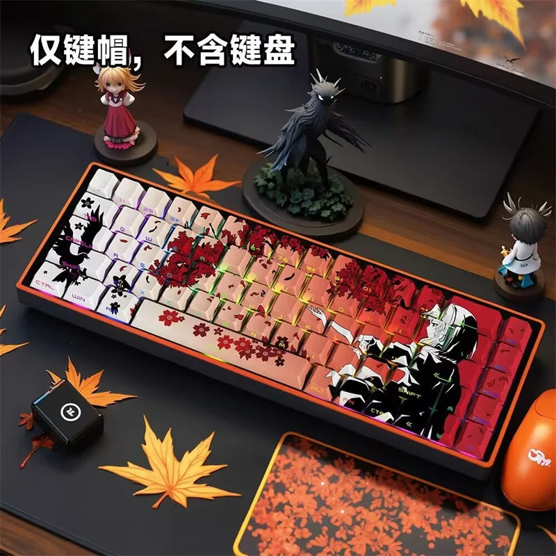 A close-up of a mechanical keyboard featuring anime themed PBT keycaps and a figurine of a bird.