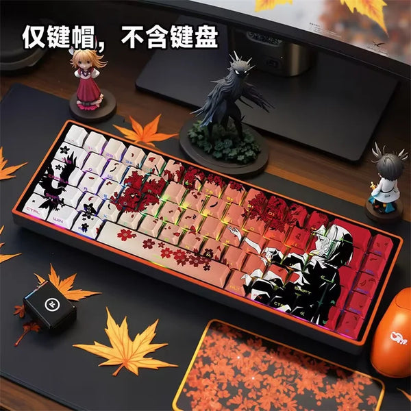 A close-up of a mechanical keyboard featuring anime themed PBT keycaps and a figurine of a bird.
