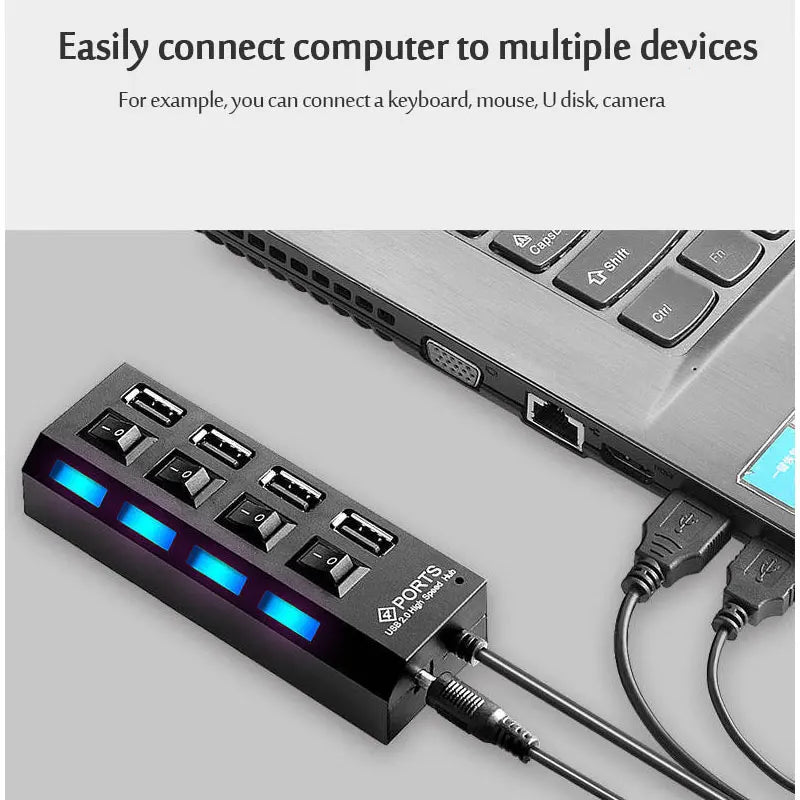 A black 7-port USB hub with individual power switches and blue LED indicators is shown connected to a laptop.