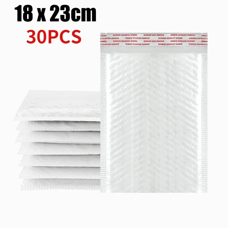 A stack of white self-sealing pearl film bubble shipping bags, measuring 18 x 23 cm, with a sheet of the product displayed ne