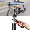 A hand holds a multifunctional selfie stick tripod with a smartphone mounted, capturing an outdoor cycling scene.
