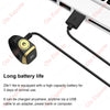 A black digital ring device with a gold accent is shown connected by a cable, illustrating its long battery life and charging