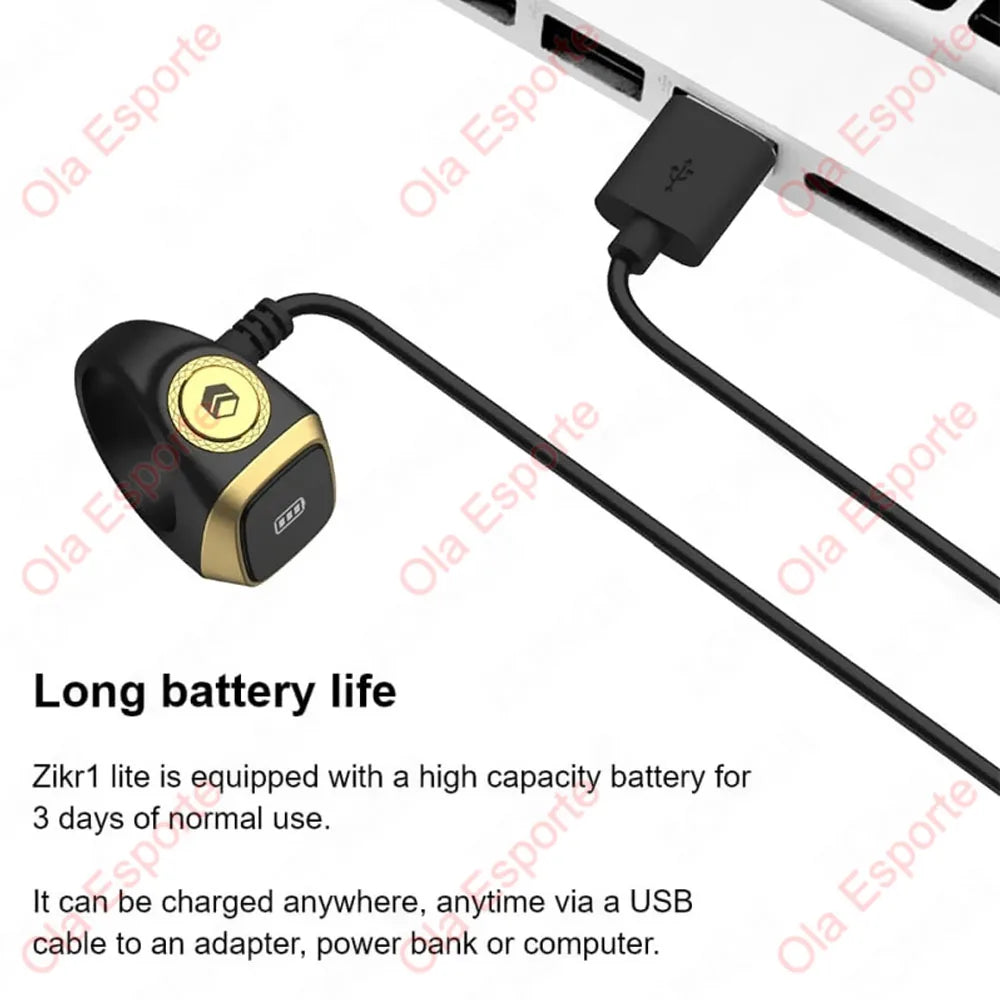 A black digital ring device with a gold accent is shown connected by a cable, illustrating its long battery life and charging