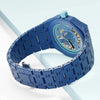 A blue ceramic watch case and strap set for a Swatch X AP Royal POP watch shown on a light surface.