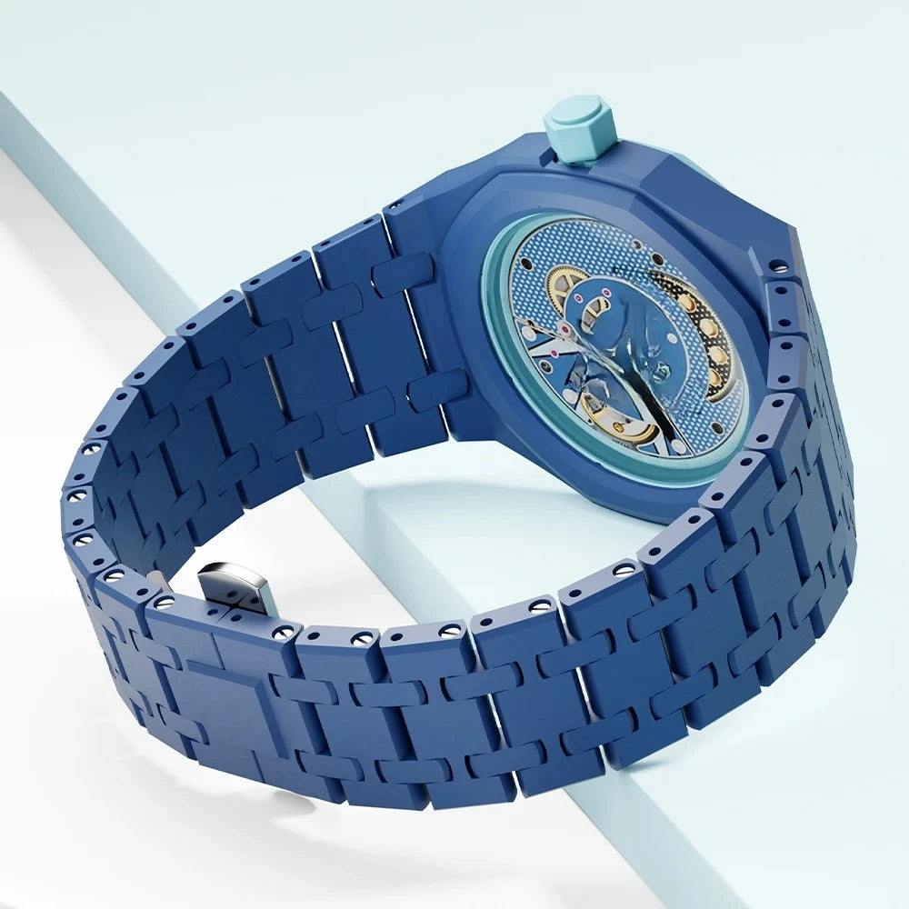 A blue ceramic watch case and strap set for a Swatch X AP Royal POP watch shown on a light surface.
