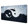 Abstract art desk mat featuring a dark wave design with a fish and light rays.