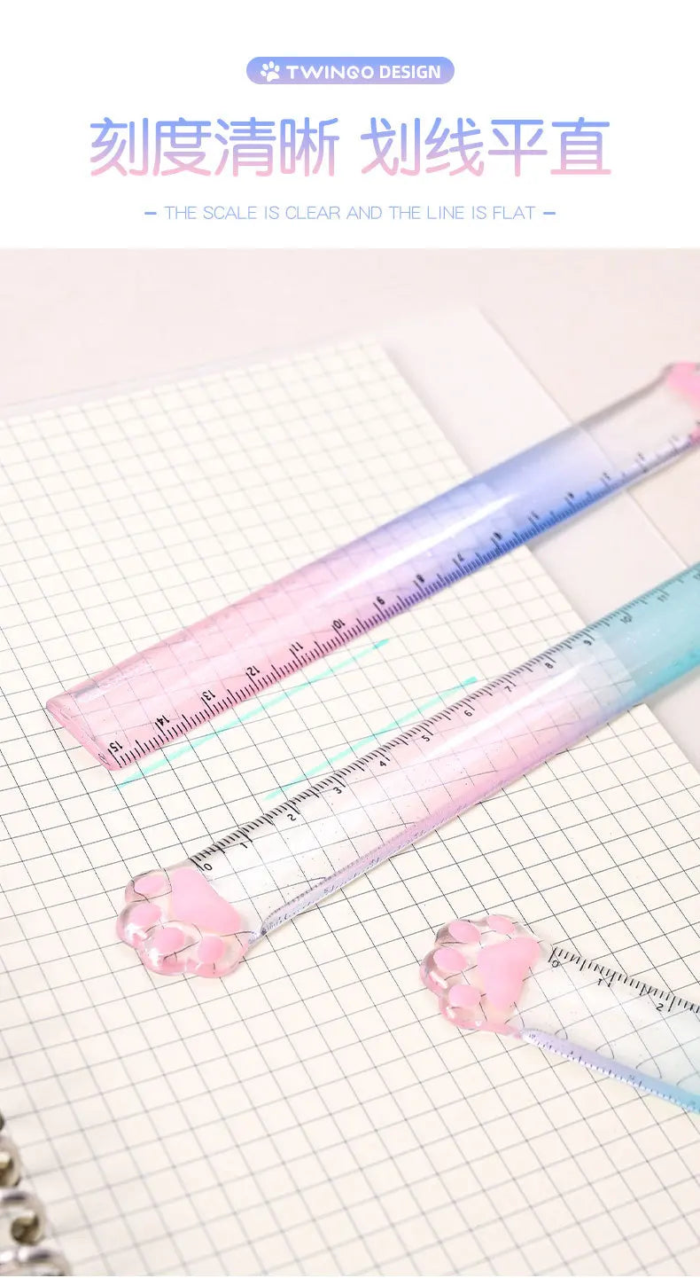 A pink gradient measuring ruler is shown next to a cat paw on a white grid paper, demonstrating a clear and flat line.