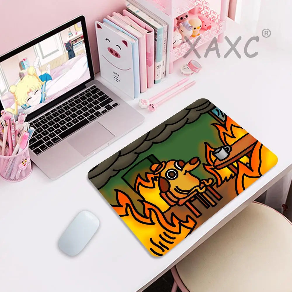 A gaming mouse pad featuring a cartoon dog sitting calmly in flames, designed for a computer mouse.