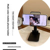 A black adjustable foldable phone and tablet stand is shown on a white surface with a smartphone displaying a video.