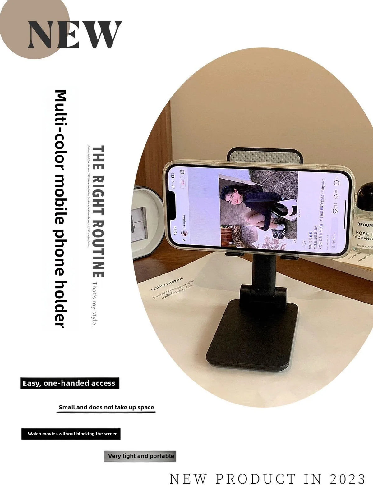 A black adjustable foldable phone and tablet stand is shown on a white surface with a smartphone displaying a video.