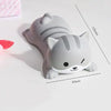 A gray, cat-shaped ergonomic wrist rest for a mouse or keyboard, shown from above.