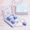 A clear plastic case containing blue cat claw keycaps and a box labeled Cat Claw Keycaps for MX Switches on a pink background