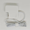 A white universal laptop charger for a MacBook Air with an attached cord.