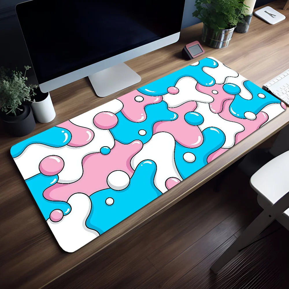 A colorful, abstract blue and pink liquid design mouse pad placed on a wooden desk.