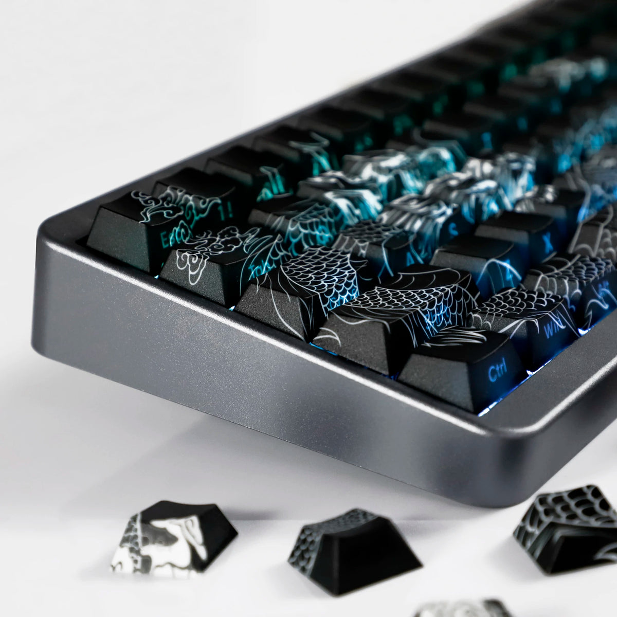Close-up of black PBT keycaps with blue side lighting on a mechanical keyboard layout.
