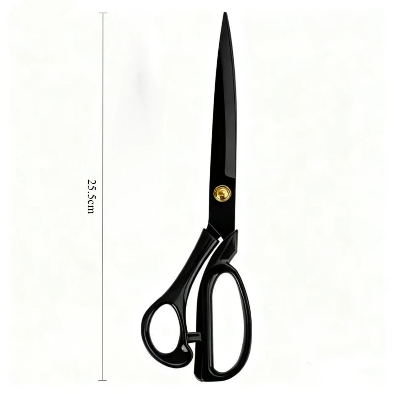 A pair of professional stainless steel tailor scissors with a black handle and gold accents.