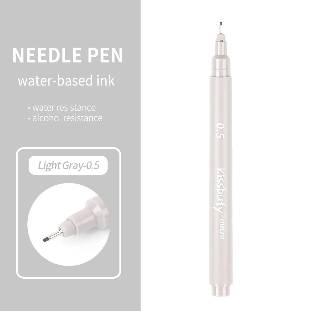A light gray needle pen with a fine tip and a cylindrical body is shown against a gray background.