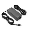 A black 65W USB-C laptop charger adapter with a cable is shown on a white background.