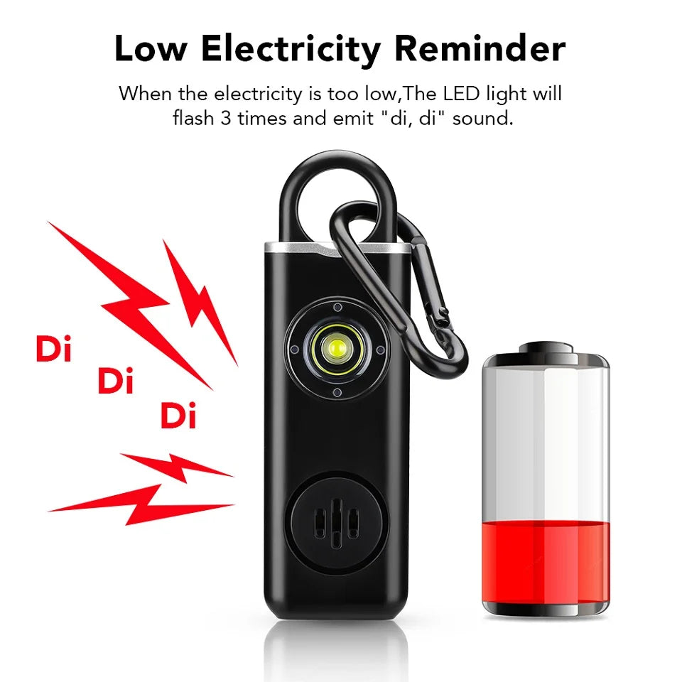 A black personal safety alarm device next to a red battery, illustrating a low electricity reminder feature.