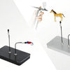 A hand holds a magnetic painting stand featuring a horse figurine and a separate tool for art and craft.