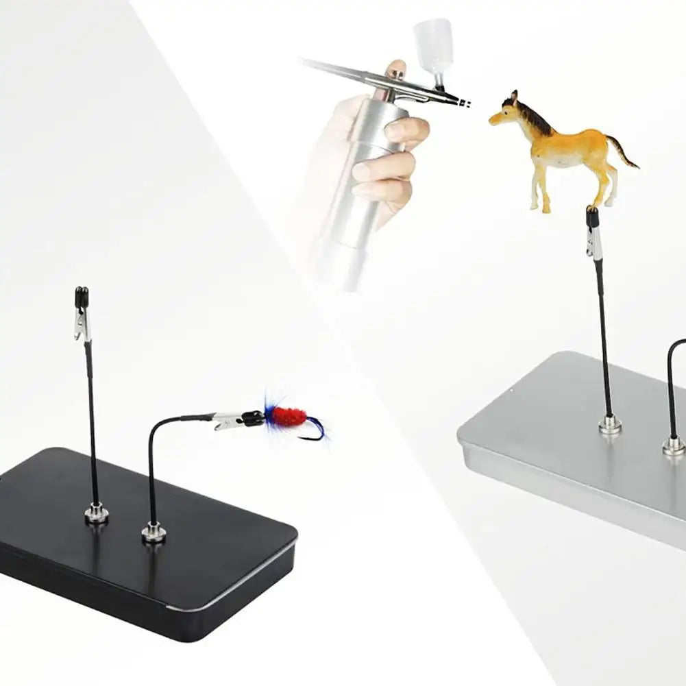 A hand holds a magnetic painting stand featuring a horse figurine and a separate tool for art and craft.