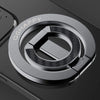 A close-up of a silver phone ring holder with the QHAPPY logo on a dark device.