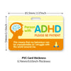Yellow PVC card for ADHD awareness with a message to be patient and a description of the struggle.