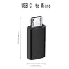 A black USB C to Micro adapter with a connector for charging and data sync.