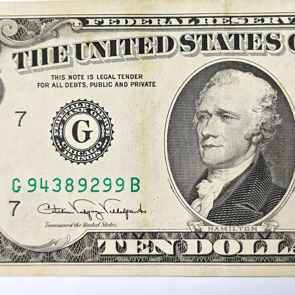 A close-up of a historical United States ten dollar banknote featuring George Washington.