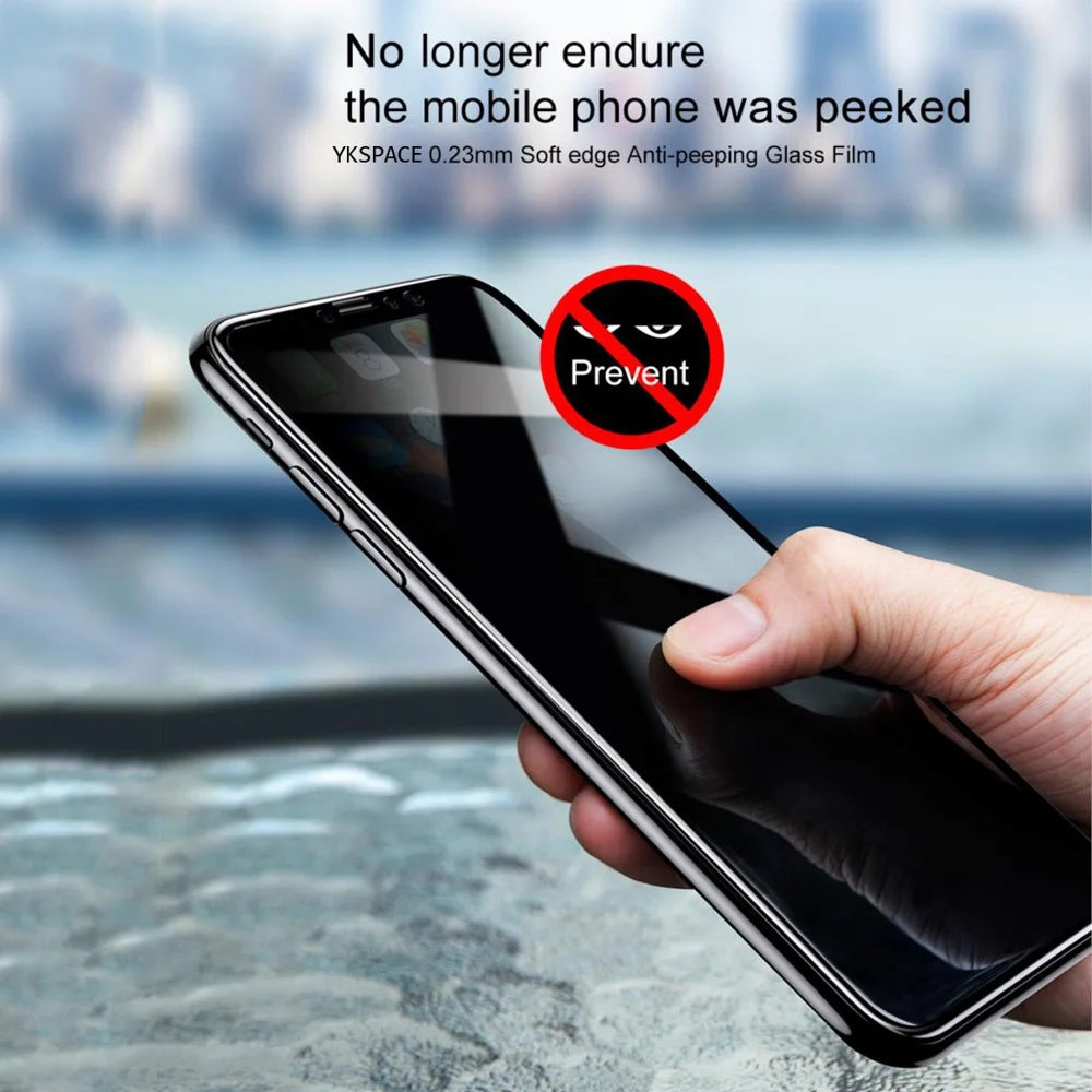 A hand holds a smartphone with an anti-peeping glass film applied to the screen.
