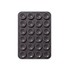 A black silicone suction phone mount with multiple circular holes for mounting devices.
