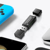 A black USB-C to SD/TF card reader adapter is shown next to a smartphone.