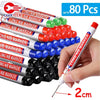 A hand is holding a long nib marker pen with a fine tip, next to a pile of 80 precision marking pens.