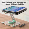 A clear acrylic stand holding a tablet and phone, demonstrating ultra-strong load bearing and stability.