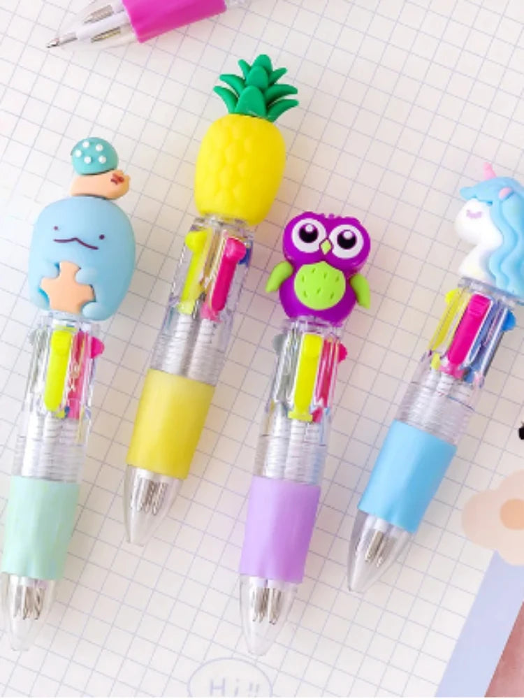 Four cute cartoon mini ballpoint pens featuring a pineapple, owl, and unicorn design on a grid background.