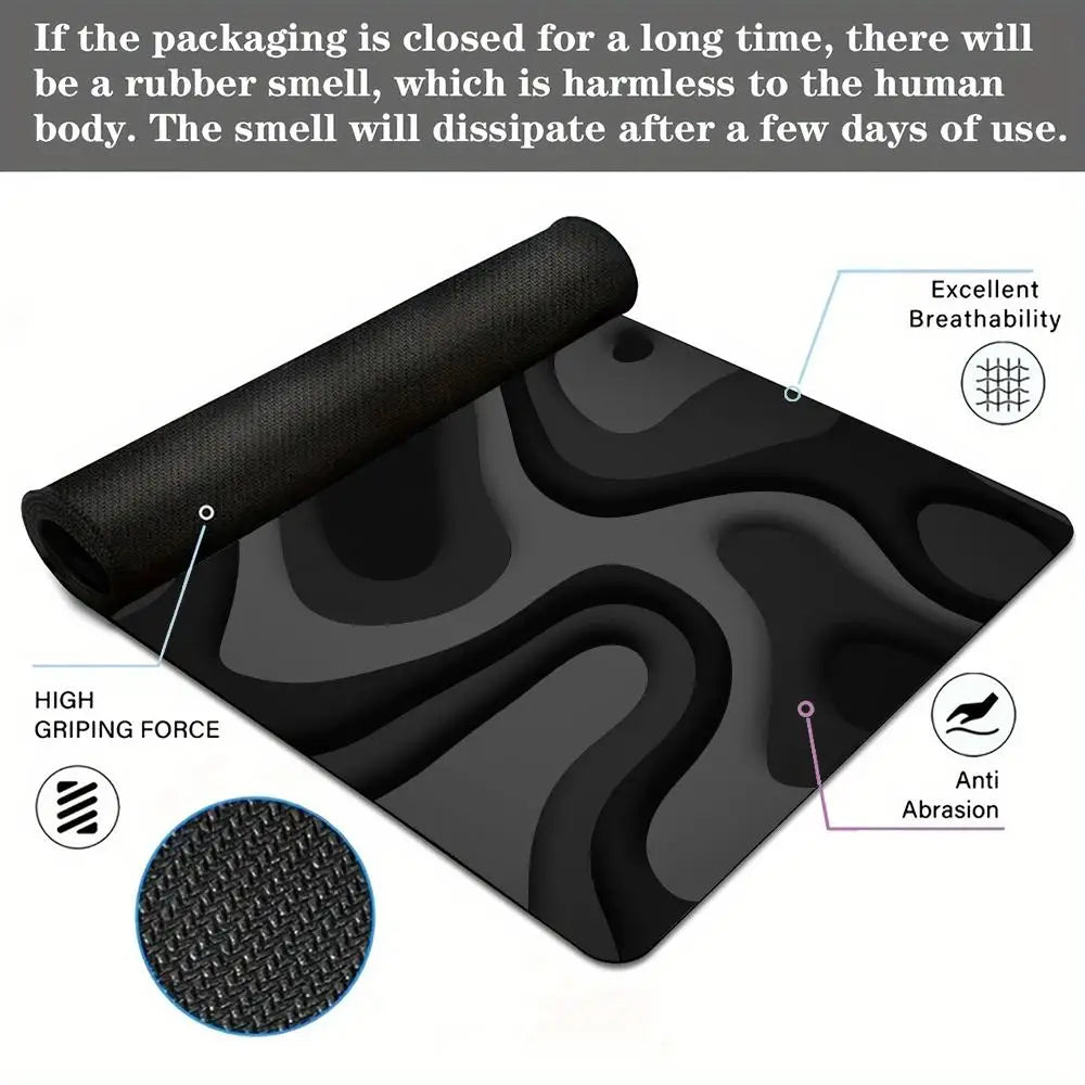 Black abstract art desk mat with a non-slip rubber base showing features like high grip and anti-abrasion