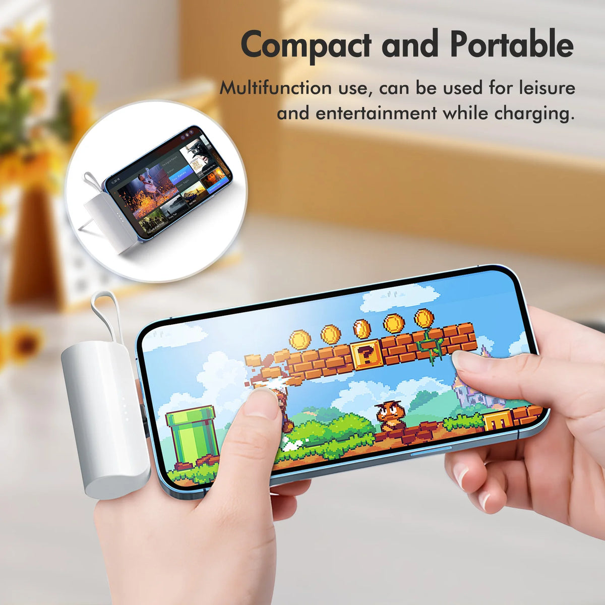 A hand holds a smartphone charging via a compact power bank, demonstrating its portable use for entertainment.